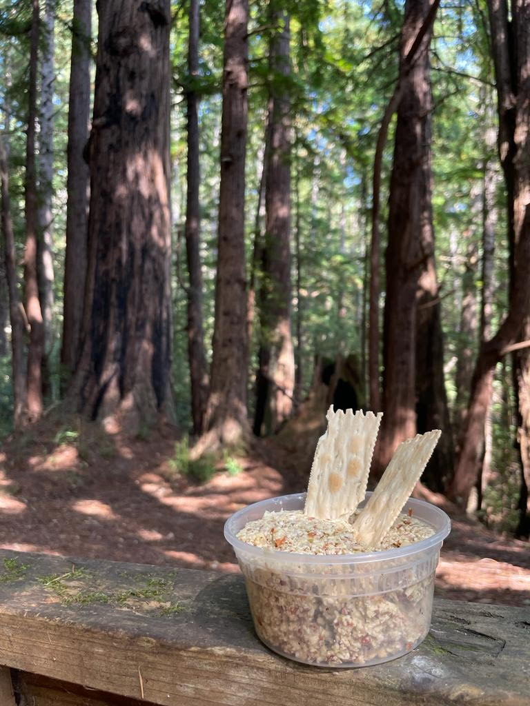 Olive spread with redwoods in background